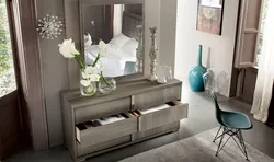 Bedroom design with chest of drawers and mirror photo