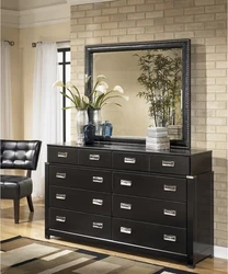 Bedroom design with chest of drawers and mirror photo