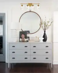 Bedroom design with chest of drawers and mirror photo