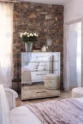 Bedroom design with chest of drawers and mirror photo