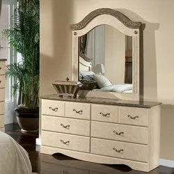 Bedroom design with chest of drawers and mirror photo