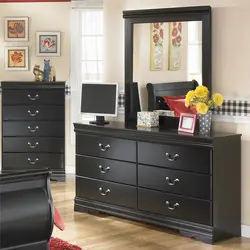 Bedroom design with chest of drawers and mirror photo