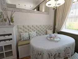 Kitchen interior with chair and bed
