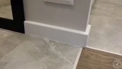 Plinth on tiles on kitchen floor photo