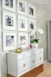 Frames with photos on the wall in the hallway