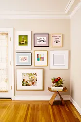 Frames with photos on the wall in the hallway