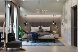 Lamps above the bed in the bedroom interior photo