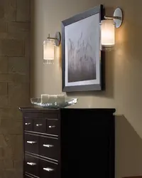 Lamps above the mirror in the hallway in the interior