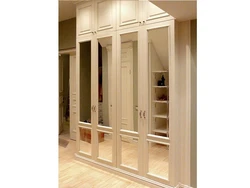 Wardrobe with a hinged mezzanine in the hallway photo