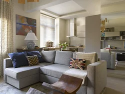 Kitchen living room design with sofa in the middle