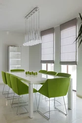 Green Chairs In The Interior Of A White Kitchen