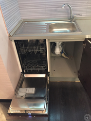 Dishwasher under the kitchen sink photo