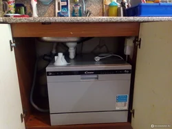 Dishwasher under the kitchen sink photo