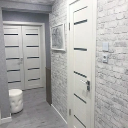 White Brick In The Interior Of The Hallway With Wallpaper