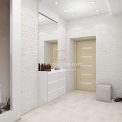 White brick in the interior of the hallway with wallpaper