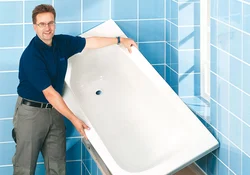 Installation of a bathtub in the bathroom photo