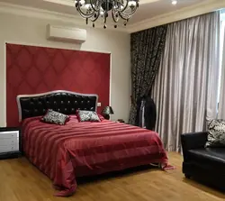 Burgundy curtains in the bedroom interior