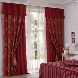 Burgundy curtains in the bedroom interior