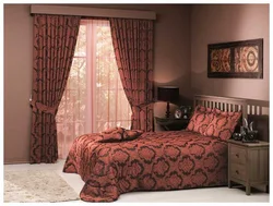 Burgundy curtains in the bedroom interior