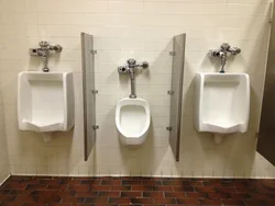 Urinal in the bathroom interior