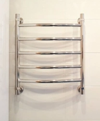 Water heated towel rail in the bath photo