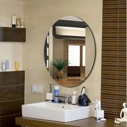 Oval mirror in the bath photo